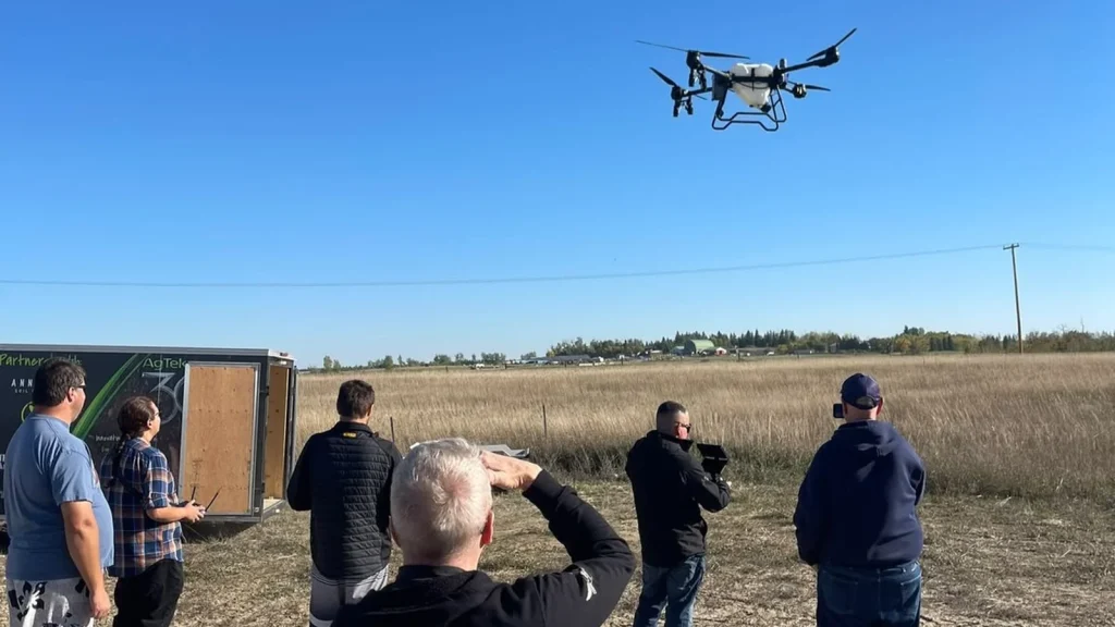 Attendees viewing EAVISION J150 at Regina agricultural drone demonstration